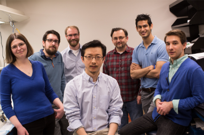 Jiou Wang and six members of his research team in a lab