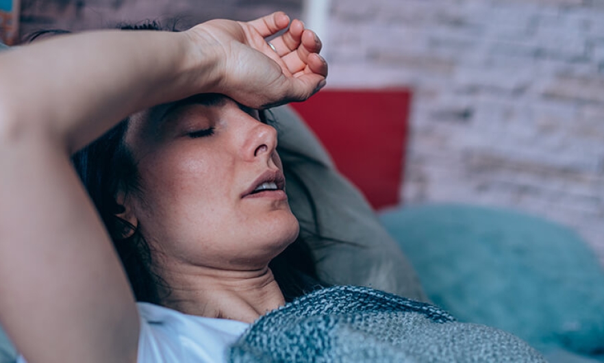 A woman resting with her arm over her head