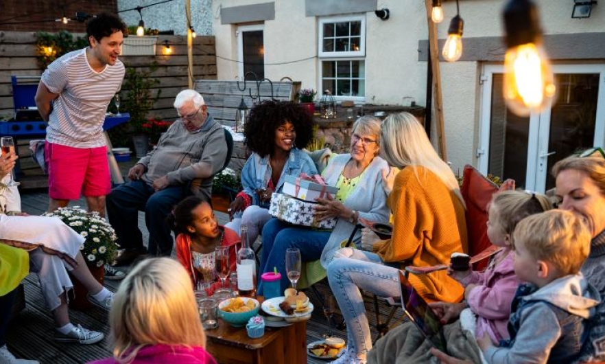 People gather at an outdoor party