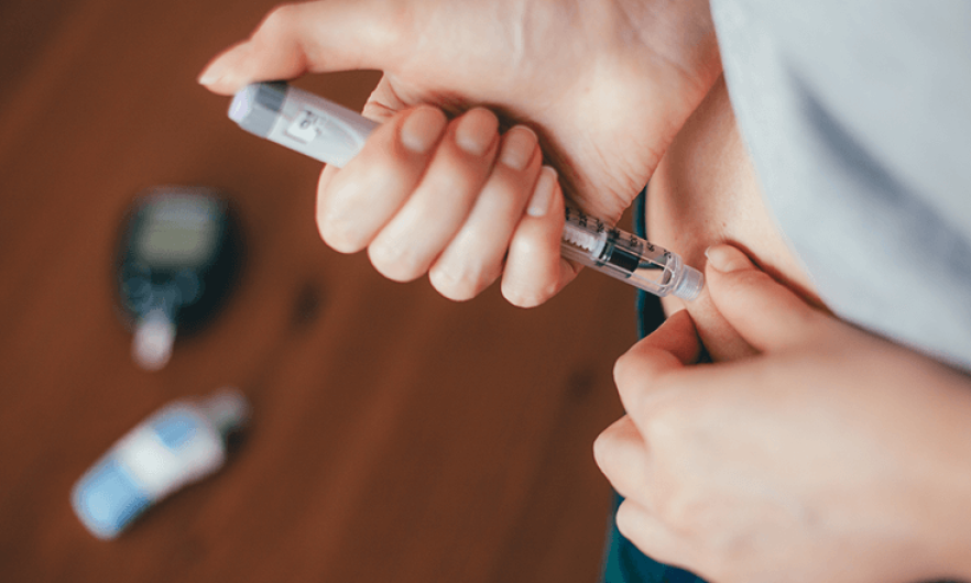 A patient self-administers insulin