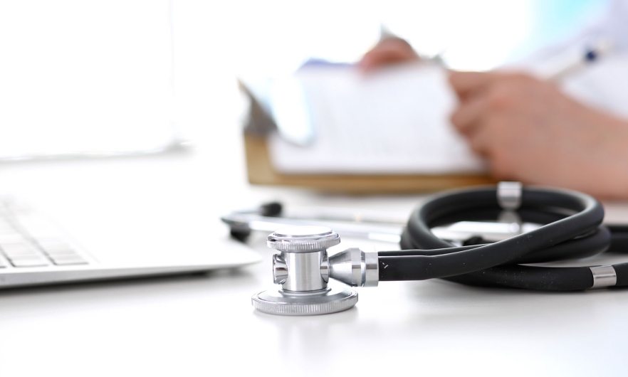 stethoscope sitting on a doctor's desk