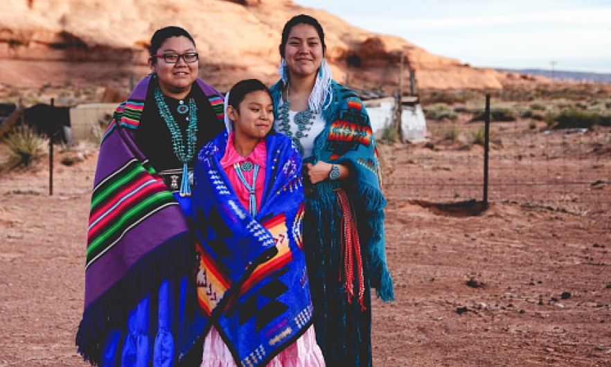 Members of a Native American tribe posing for a photo