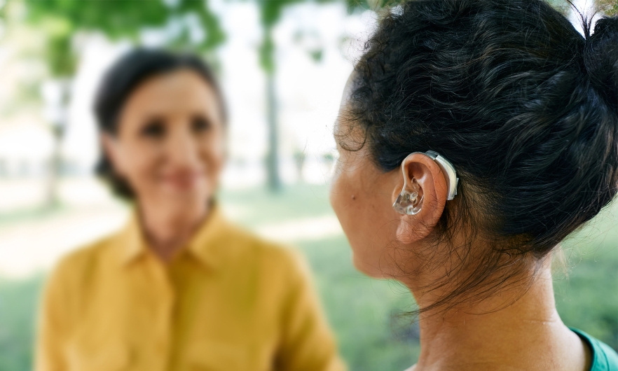 A woman wearing a hearing aid