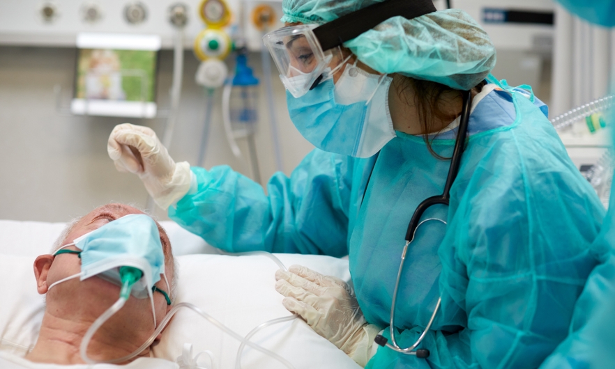 Individual on a ventilator in hospital 