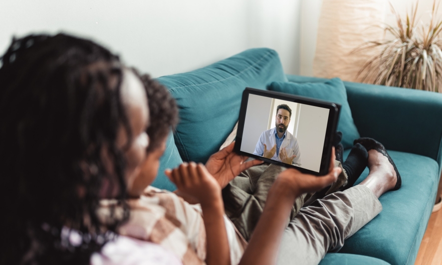 Woman with child on a telehealth call