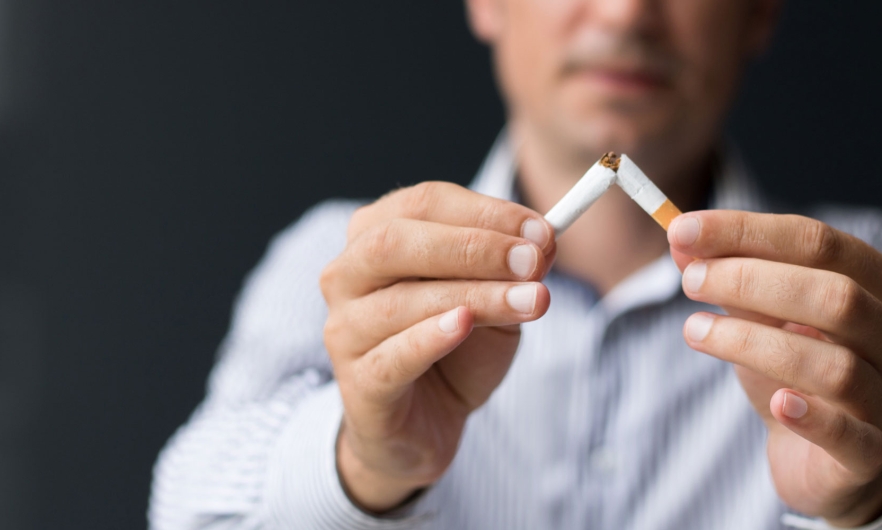 Man holding cigarettes