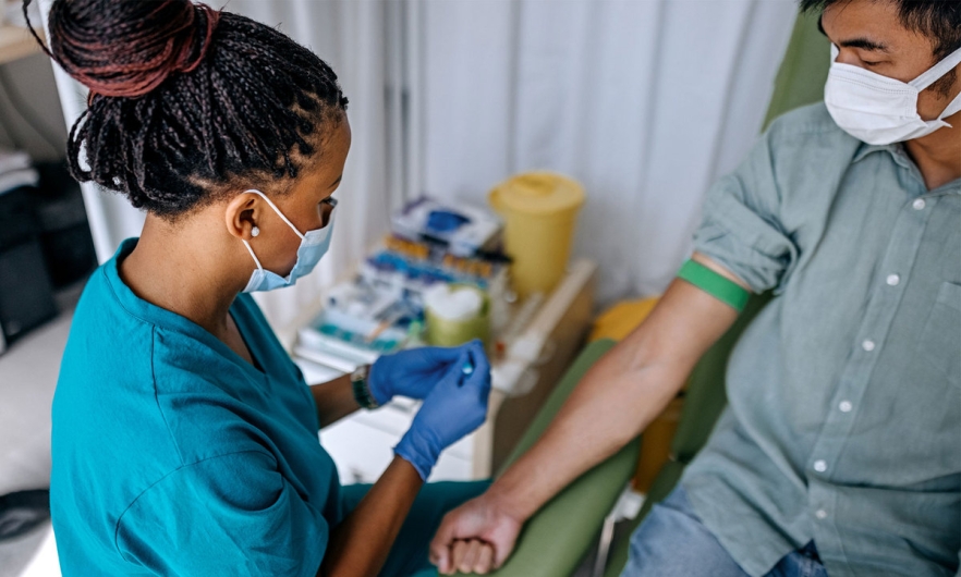 Patient with tourniquet getting blood drawn