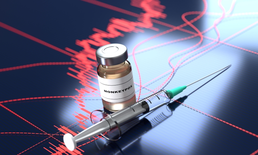 monkeypox vaccine vial and syringe across a data chart