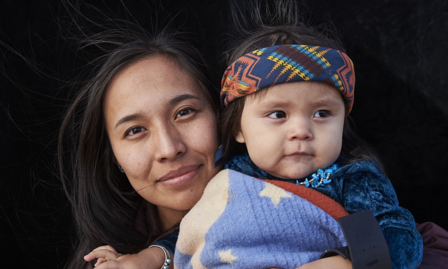 Photograph of mother holding baby.