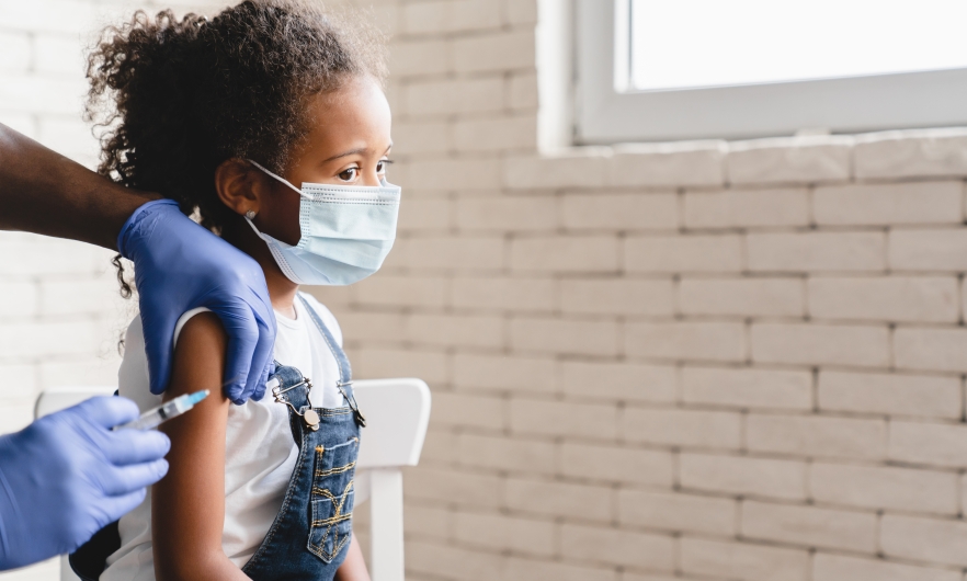 Small child getting a vaccine