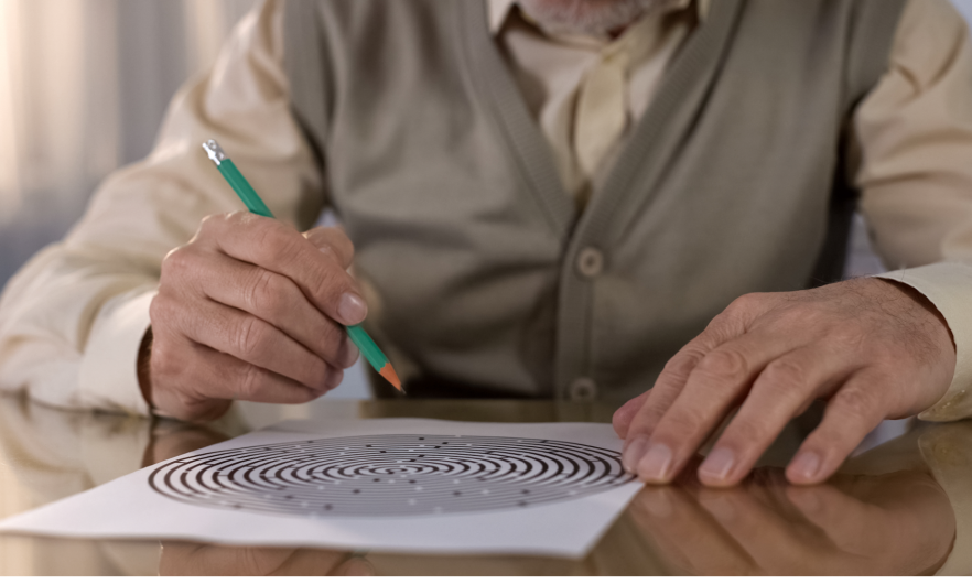 elderly man doing puzzle 