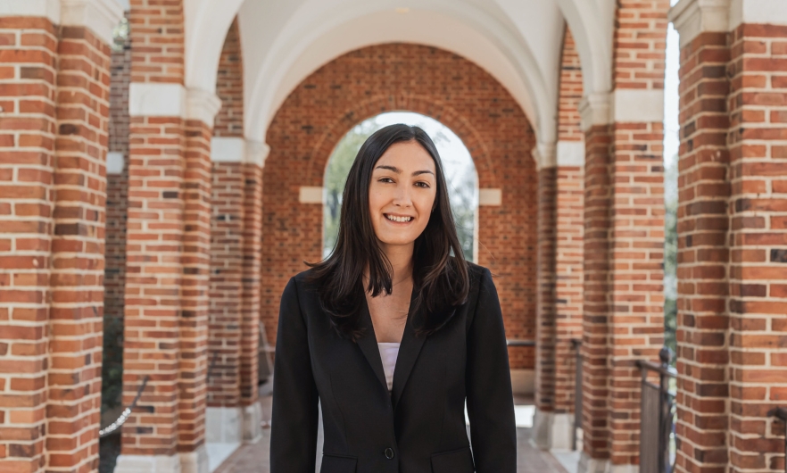 young woman standing on college campus