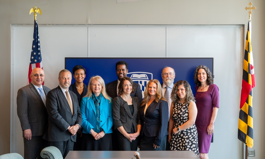 photo of transportation officials and JHU faculty