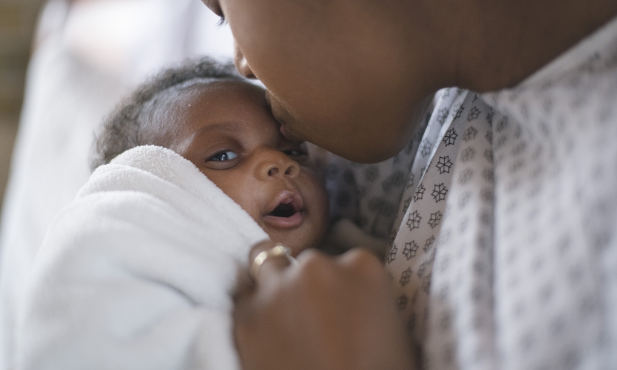 A newborn and mother in a hospital