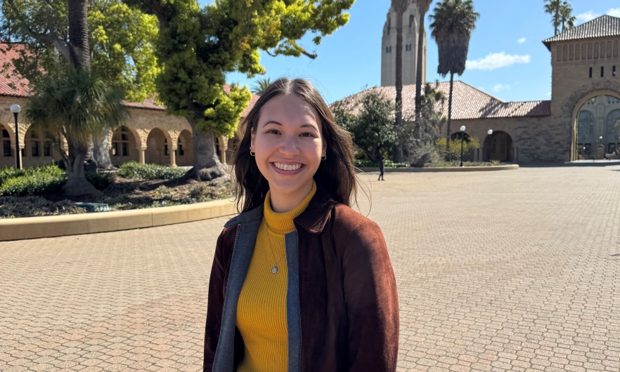 Young woman posing in front of trees