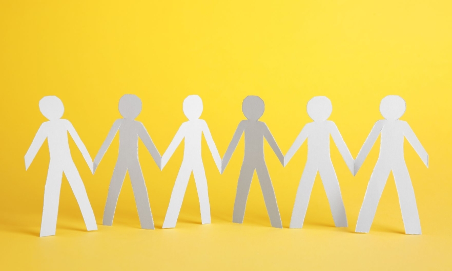 A paper stick figure chain of people holding hands