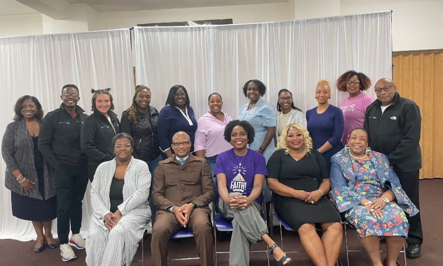 Group of men and women sitting and standing