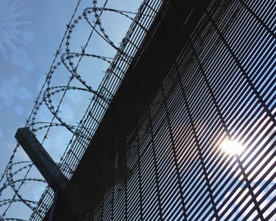 Prison walls with barbed wire