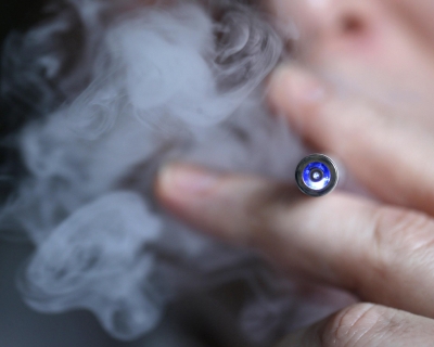 person using an e-cigarette