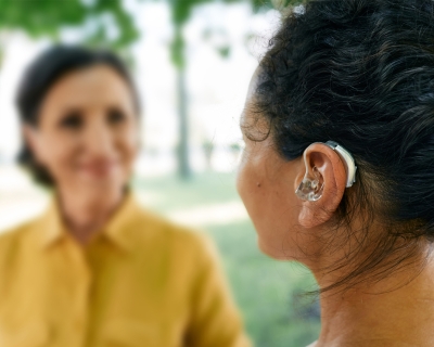 A woman wearing a hearing aid