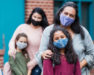 Moms with children wearing masks 