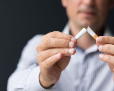 Man holding cigarettes