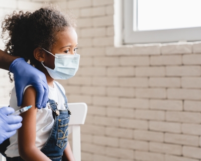 Small child getting a vaccine