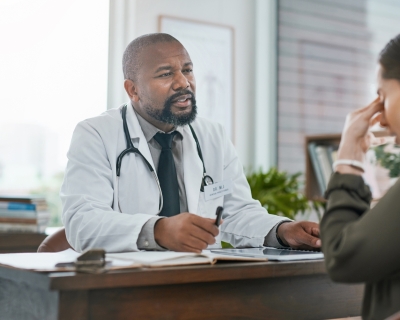 A frustrated patient sitting in front a doctor