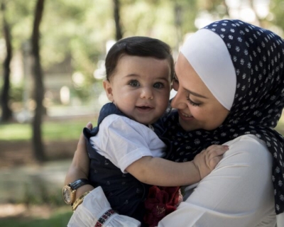 Mother affectionately holding her baby.