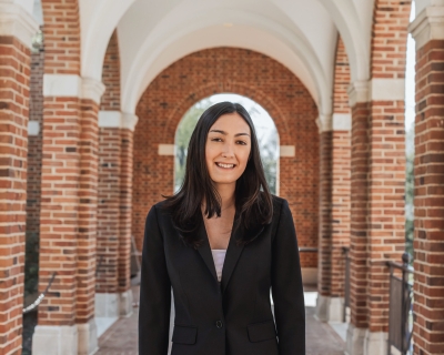 young woman standing on college campus