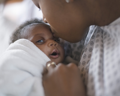 A newborn and mother in a hospital