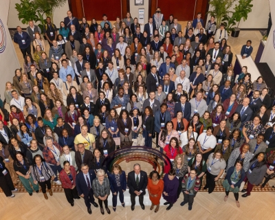 Group photo from above of Bloomberg American Health Initiative fellows and leadership at 2024 summit