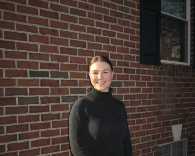 Young woman standing in front of building