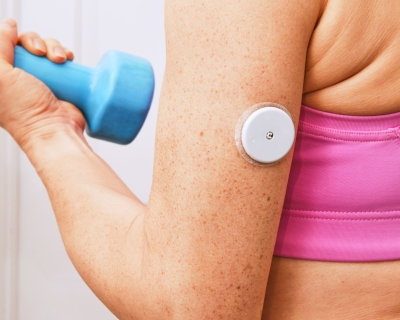 image of woman lifting a dumbbell