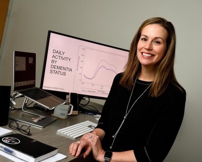 Dr. Jennifer Schrack sitting at desk