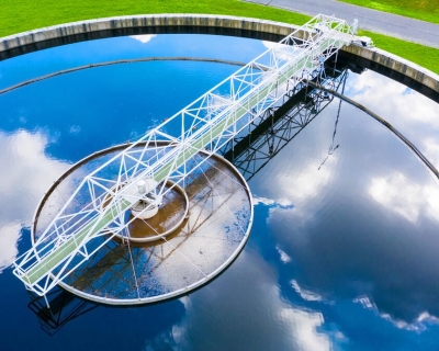 aerial view of a water treatment trough reflecting clouds