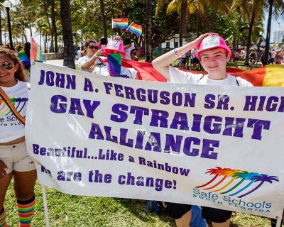 Teens holding a banner for Gay Straight Alliance at the Gay Pride Parade on &#039;Ocean Drive&#039;. Image: Jeffrey Greenberg/Universal Images Group