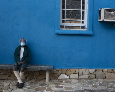 A leprosy patient sits outside the abandoned Curupaiti Colony Hospital in Rio de Janeiro on November 21, 2021.