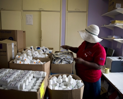 A health worker manages supplies in a PEPFAR-funded AIDS clinic in Johannesburg, South Africa, on January 27, 2012