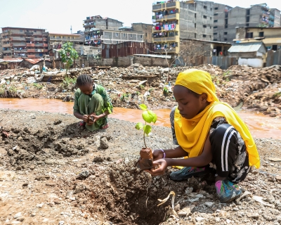 Local teenage girls resident of Kiamako slum take part in planting a tree near a site of homes destroyed by floods along the bank of Mathare river. Nairobi, Kenya, June 5, 2024. 