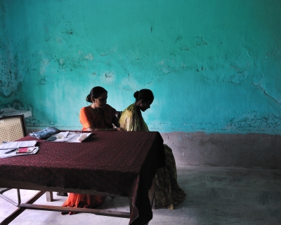 Dr. Renu Singh checks a patient for possible signs of tuberculosis in the district TB center in Patna, Bihar, India, on August 10, 2010.