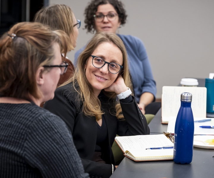 Elise Pas, PhD, interacts with fellow faculty.