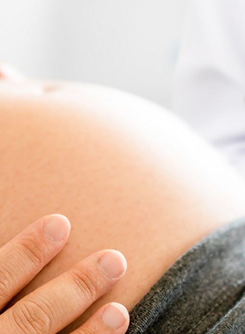 pregnant woman having a check-up with doctor