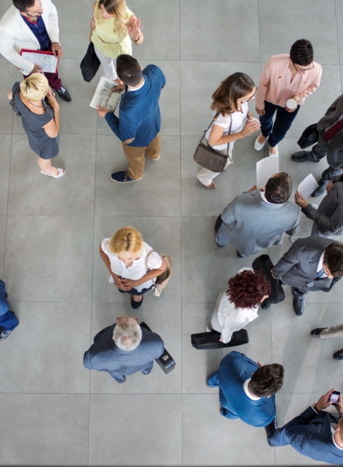 Overhead view of people in hallway