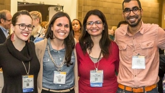 Four international students at an event