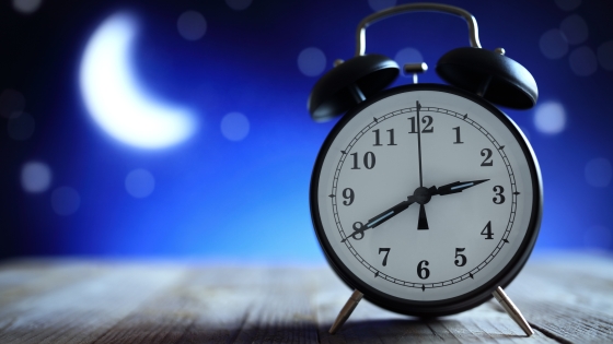 photo of clock and moon suggesting insomnia