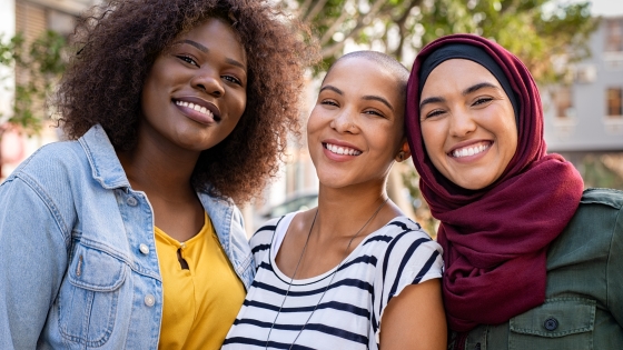 Three women smiling