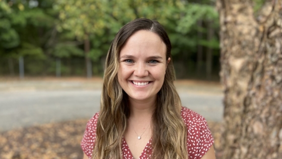 young woman outdoors smiling 