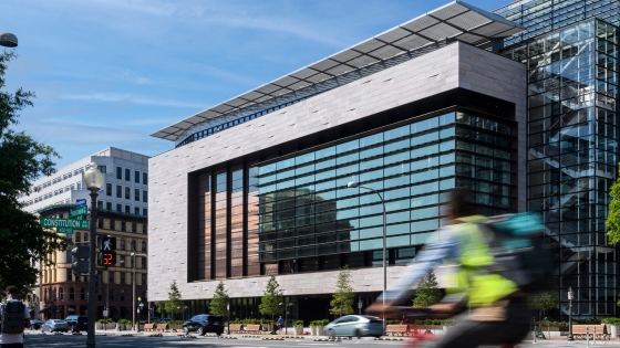 555 Penn facing NW, with a cyclist riding a red bike.