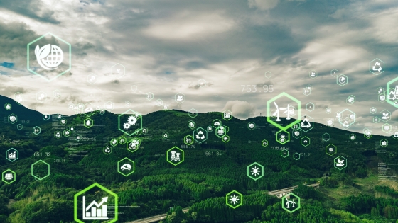 Illustration of multiple icons floating above a green landscape.